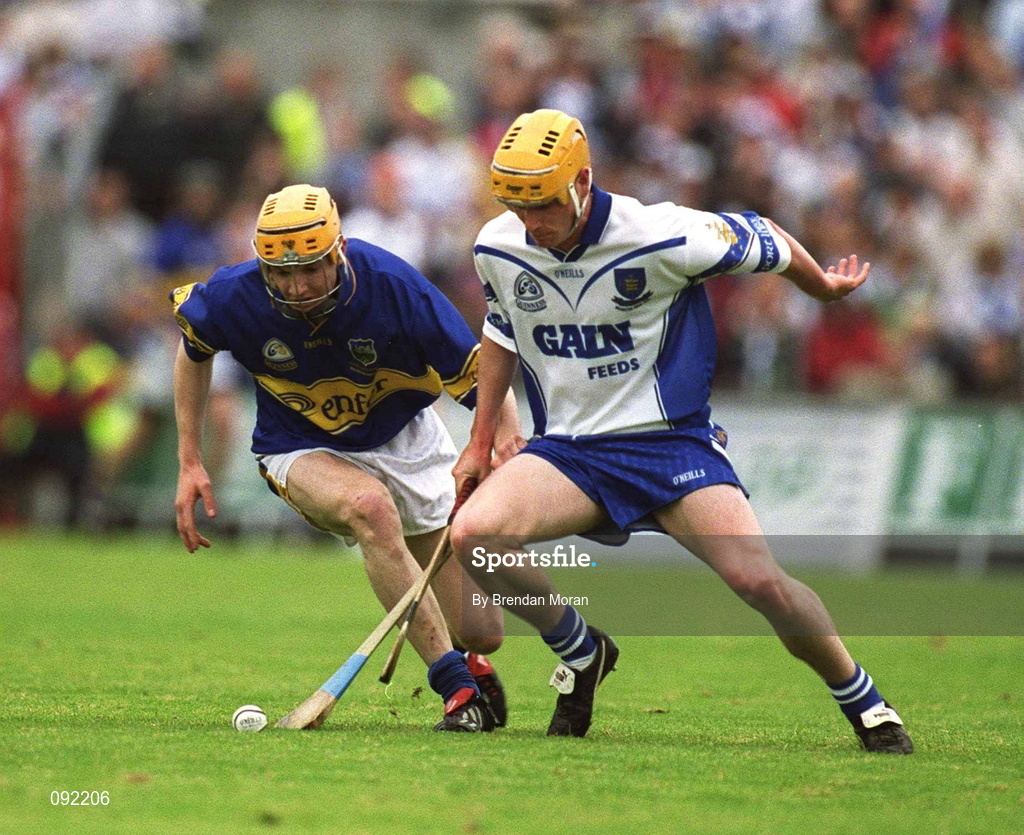 30 June 2002; Lar Corbett of Tipperary in action against Waterford's Eoin Murphy during the Guinness Munster Senior Hurling Championship Final match between Waterford and Tipperary at Páirc Uí Chaoimh in Cork. Photo by Brendan Moran/Sportsfile