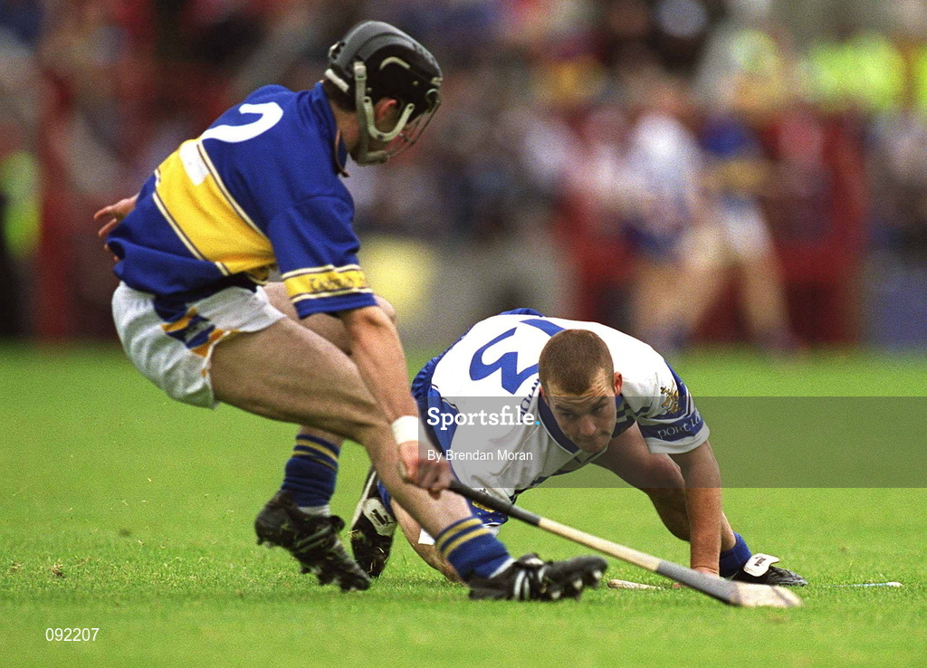 30 June 2002; Eoin McGrath of Waterford in action against Thomas Costello of Tipperary during the Guinness Munster Senior Hurling Championship Final match between Waterford and Tipperary at Páirc Uí Chaoimh in Cork. Photo by Brendan Moran/Sportsfile