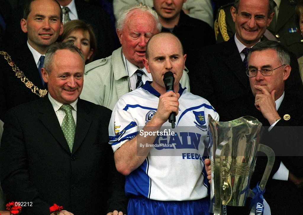 30 June 2002; Waterford captain Fergal Hartley makes his speech in the company of Christy Cooney, Chairman of the Munster Council, right, and Michael Whelan of Guinness following the Guinness Munster Senior Hurling Championship Final match between Waterford and Tipperary at Páirc Uí Chaoimh in Cork. Photo by Brendan Moran/Sportsfile