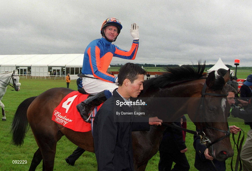30 June 2002; Jockey Mick Kinane celebrates after riding High Chaparral to victory in the Budweiser Irish Derby at The Curragh Racecourse in Kildare. Photo by Damien Eagers/Sportsfile