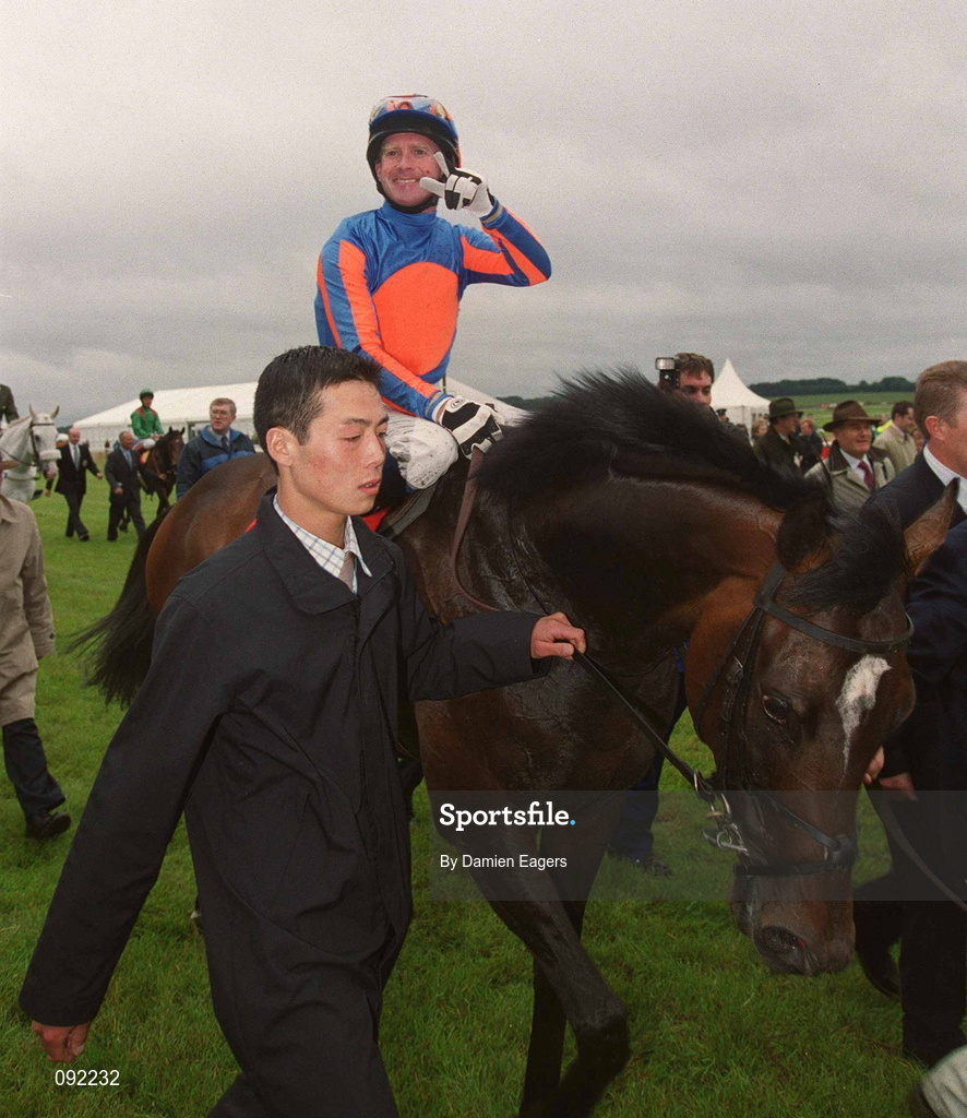 30 June 2002; Jockey Mick Kinane celebrates after riding High Chaparral to victory in the Budweiser Irish Derby at The Curragh Racecourse in Kildare. Photo by Damien Eagers/Sportsfile