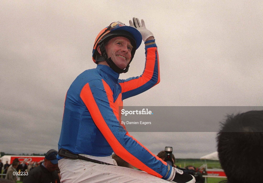 30 June 2002; Jockey Mick Kinane celebrates after riding High Chaparral to victory in the Budweiser Irish Derby at The Curragh Racecourse in Kildare. Photo by Damien Eagers/Sportsfile