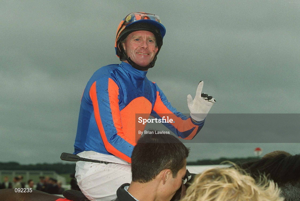 30 June 2002; Jockey Mick Kinane celebrates after riding High Chaparral to victory in the Budweiser Irish Derby at The Curragh Racecourse in Kildare. Photo by Brian Lawless/Sportsfile