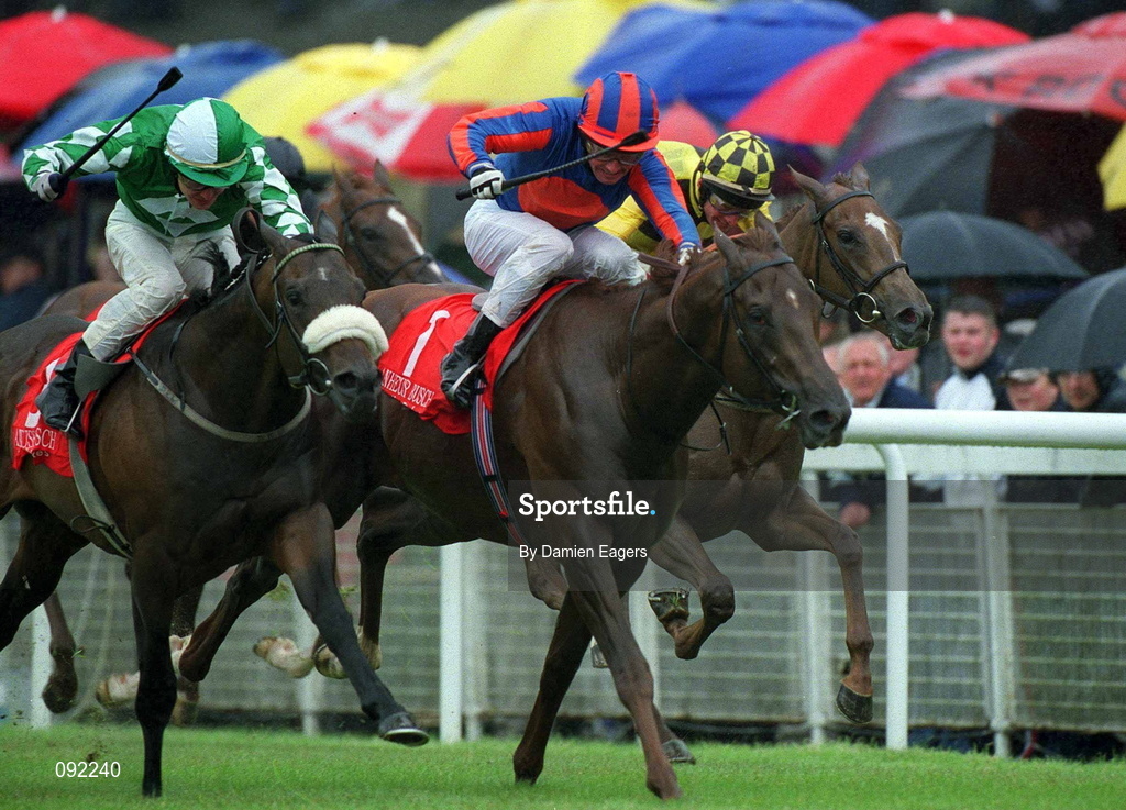 30 June 2002; Hold That Tiger, centre, with Mick Kinane up, races clear of Pakhoes, left, Pat Smullen up, and Luminata, right, Kevin Manning up, on their way to winning the Anheuser Busch Railway Stakes at The Curragh Racecourse in Kildare. Photo by Damien Eagers/Sportsfile