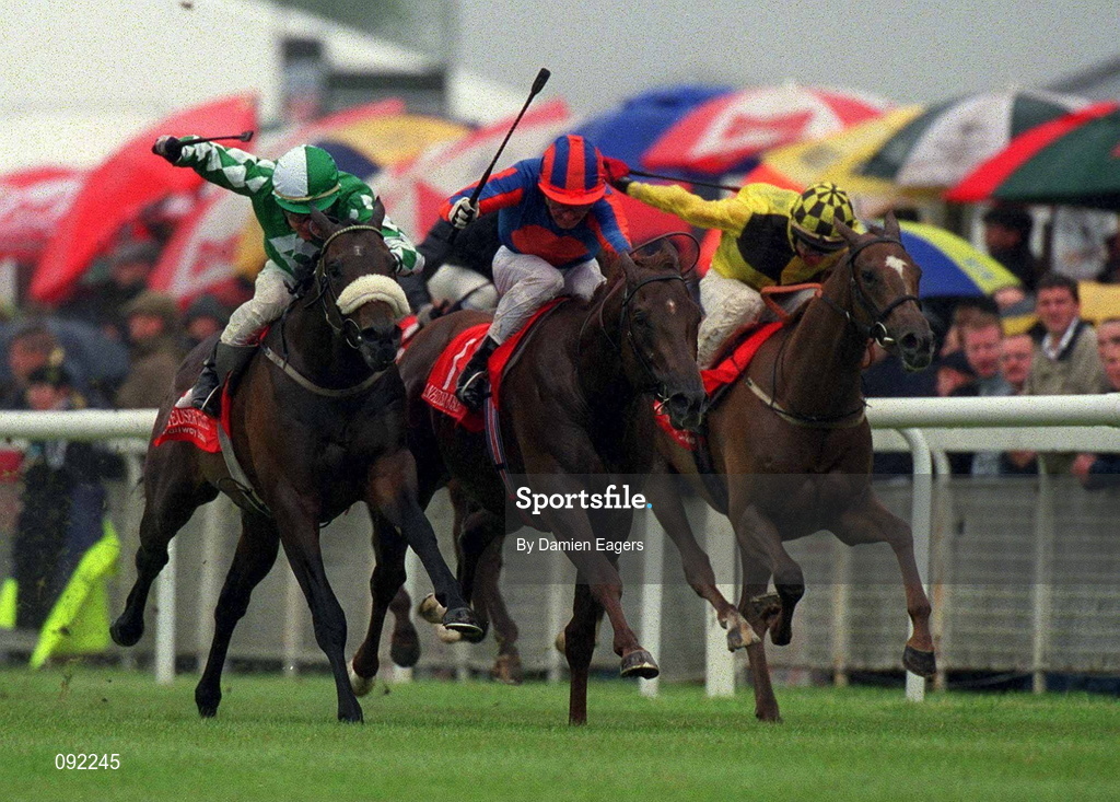 30 June 2002; Hold That Tiger, with Mick Kinane up, races clear of Pakhoes, left, with Pat Smullen up, and Luminata, right, with Kevin Manning up, on their way to winning the Anheuser Busch Railway Stakes at The Curragh Racecourse in Kildare. Photo by Damien Eagers/Sportsfile
