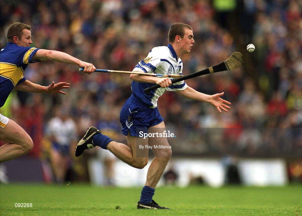 30 June 2002; Eoin Kelly of Waterford in action against Tipperary's Conor Gleeson during the Guinness Munster Senior Hurling Championship Final match between Waterford and Tipperary at Páirc Uí Chaoimh in Cork. Photo by Ray McManus/Sportsfile