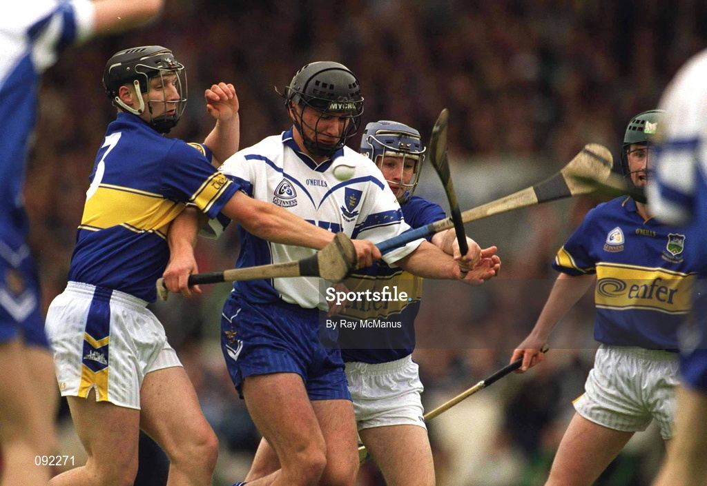 30 June 2002; Waterford's Seamus Prendergast in action against Tipperary players Philip Maher and Paul Kelly during the Guinness Munster Senior Hurling Championship Final match between Waterford and Tipperary at Páirc Uí Chaoimh in Cork. Photo by Ray McManus/Sportsfile