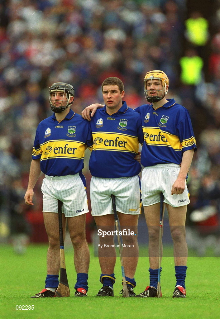 30 June 2002; Tipperary forward line, from left, Eoin Kelly, John Carroll and Lar Corbett stand for the National Anthem during the Guinness Munster Senior Hurling Championship Final match between Waterford and Tipperary at Páirc Uí Chaoimh in Cork. Photo by Brendan Moran/Sportsfile