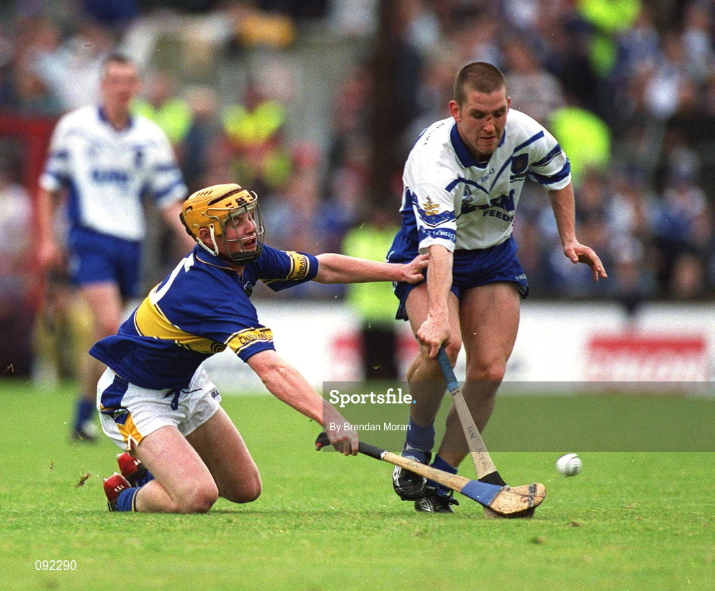 30 June 2002; Ken McGrath of Waterford in action against Eamonn Corcoran of Tipperary during the Guinness Munster Senior Hurling Championship Final match between Waterford and Tipperary at Páirc Uí Chaoimh in Cork. Photo by Brendan Moran/Sportsfile