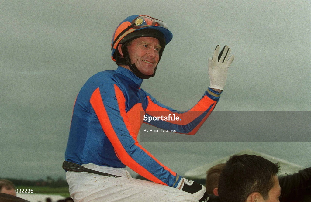 30 June 2002; Jockey Mick Kinane celebrates after riding High Chaparral to victory in the Budweiser Irish Derby at The Curragh Racecourse in Kildare. Photo by Brian Lawless/Sportsfile
