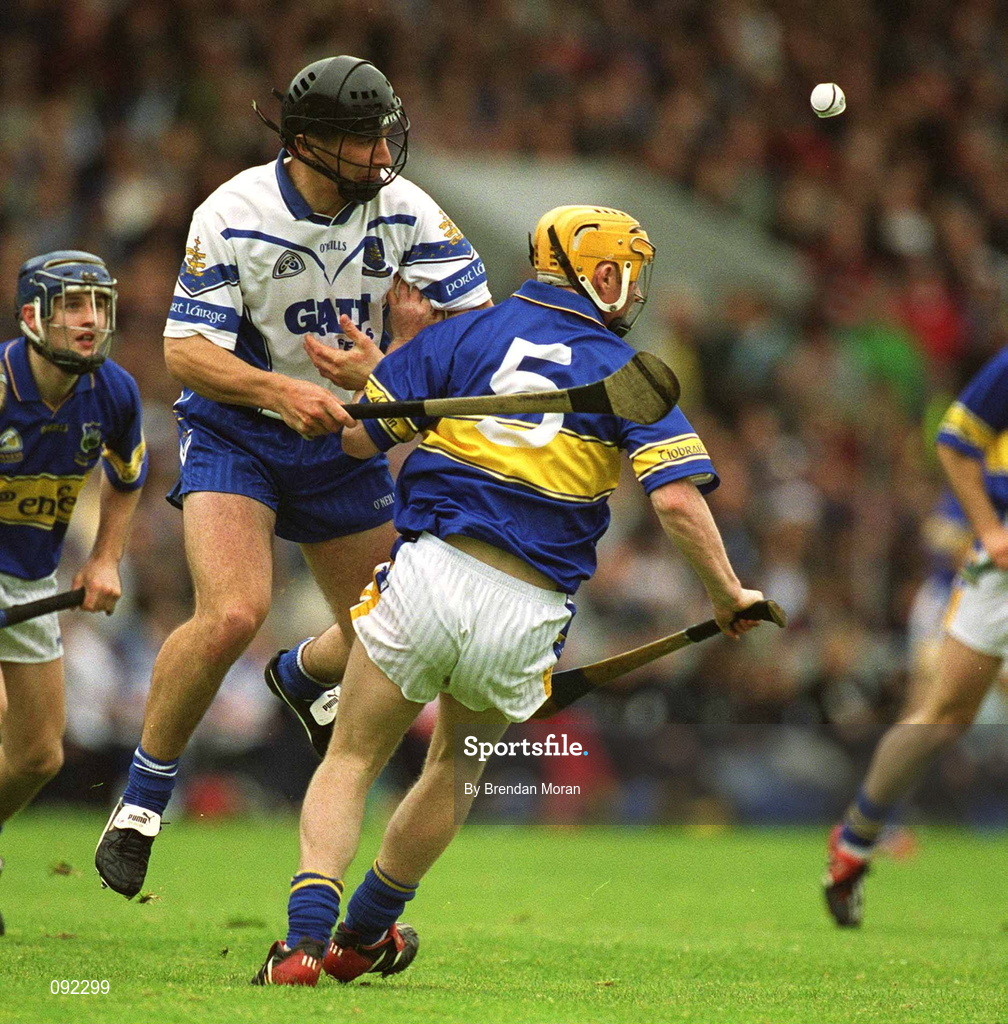 30 June 2002; Seamus Prendergast of Waterford in action against Paul Kelly of Tipperary during the Guinness Munster Senior Hurling Championship Final match between Waterford and Tipperary at Páirc Uí Chaoimh in Cork. Photo by Brendan Moran/Sportsfile