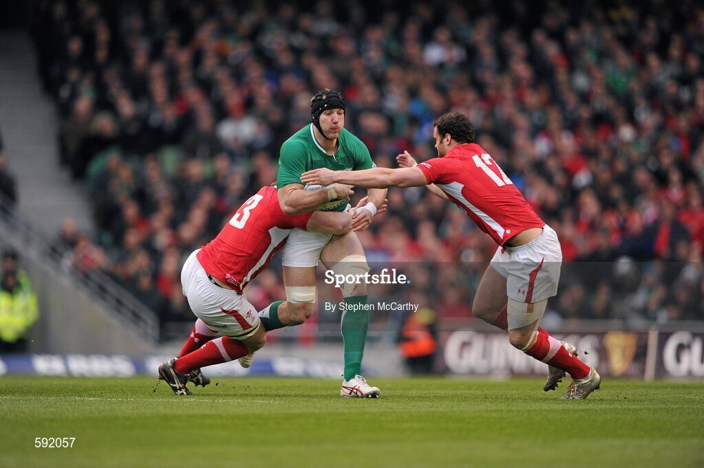 5 February 2012; Stephen Ferris, Ireland, is tackled by Jonathan Davies and Jamie Roberts, right, Wales. RBS Six Nations Rugby Championship, Ireland v Wales, Aviva Stadium, Lansdowne Road, Dublin. Picture credit: Stephen McCarthy / SPORTSFILE