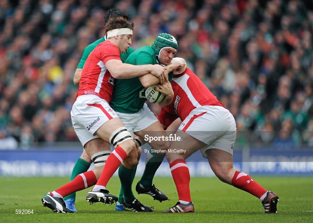 5 February 2012; Rory Best , Ireland, is tackled by Ryan Jones and Adam Jones, right, Wales. RBS Six Nations Rugby Championship, Ireland v Wales, Aviva Stadium, Lansdowne Road, Dublin. Picture credit: Stephen McCarthy / SPORTSFILE