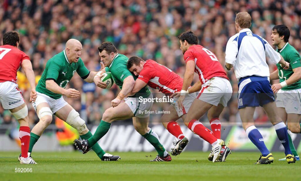 5 February 2012; Cian Healy, Ireland, with support from team mate Paul O'Connell, is tackled by Huw Bennett and Mike Phillips, right, Wales. RBS Six Nations Rugby Championship, Ireland v Wales, Aviva Stadium, Lansdowne Road, Dublin. Picture credit: Brian Lawless / SPORTSFILE