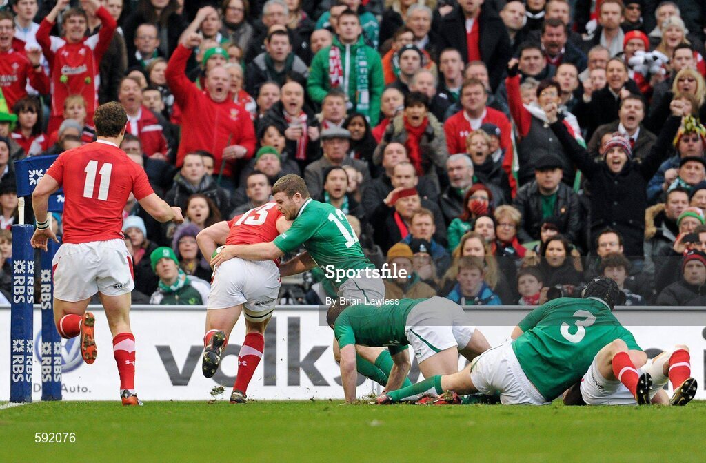 5 February 2012; Jonathan Davies, Wales, goes over to score his side's first try, despite the efforts of Gordon D'Arcy, Ireland. RBS Six Nations Rugby Championship, Ireland v Wales, Aviva Stadium, Lansdowne Road, Dublin. Picture credit: Brian Lawless / SPORTSFILE