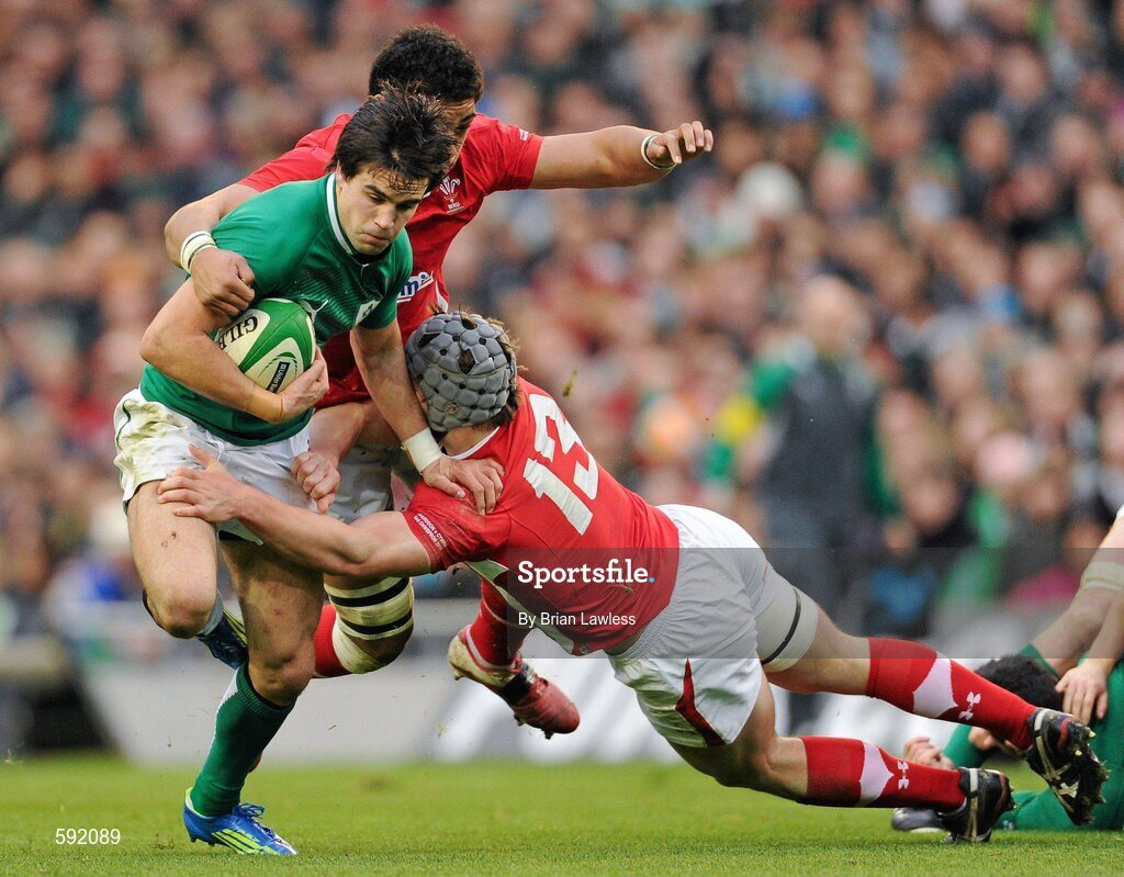 5 February 2012; Conor Murray, Ireland, is tackled by Toby Faletau, behind, and Jonathan Davies, Wales. RBS Six Nations Rugby Championship, Ireland v Wales, Aviva Stadium, Lansdowne Road, Dublin. Picture credit: Brian Lawless / SPORTSFILE