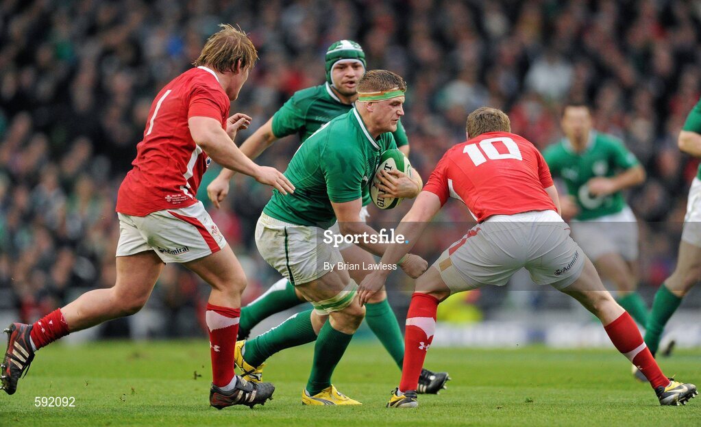 5 February 2012; Jamie Heaslip, Ireland, is tackled by Rhys Gill, left, and Rhys Priestland, Wales. RBS Six Nations Rugby Championship, Ireland v Wales, Aviva Stadium, Lansdowne Road, Dublin. Picture credit: Brian Lawless / SPORTSFILE