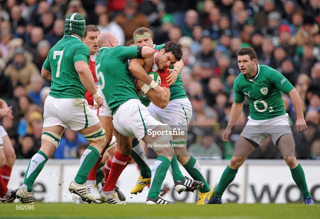 5 February 2012; Mike Phillips, Wales, is tackled by Paul O'Connell, left, and Jamie Heaslip, Ireland. RBS Six Nations Rugby Championship, Ireland v Wales, Aviva Stadium, Lansdowne Road, Dublin. Picture credit: Brendan Moran / SPORTSFILE