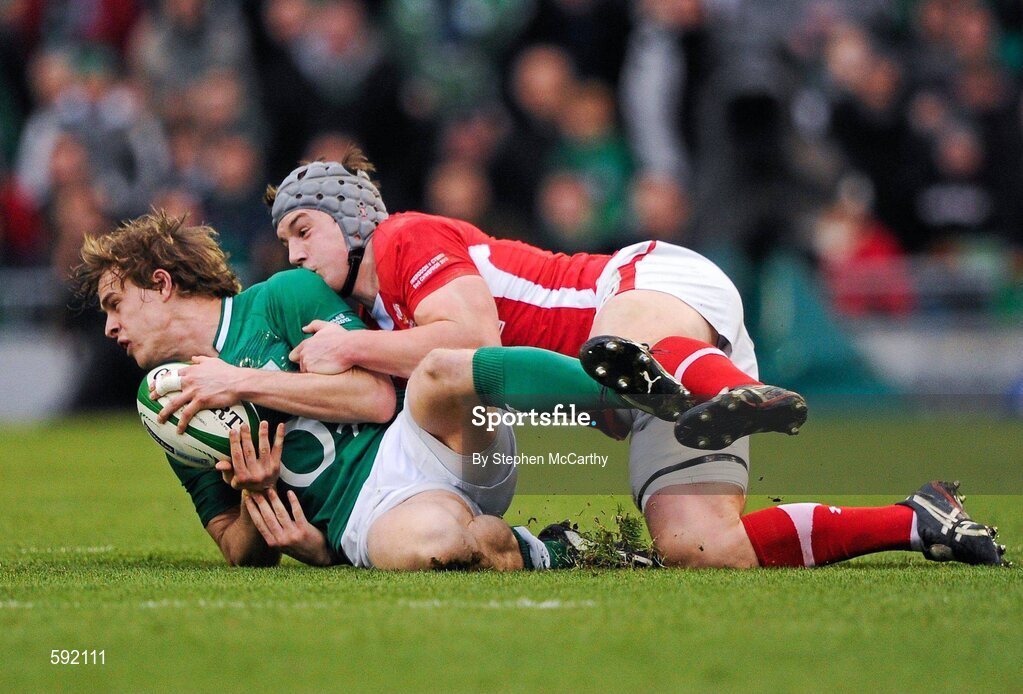 5 February 2012; Andrew Trimble, Ireland, is tackled by Jonathan Davies, Wales. RBS Six Nations Rugby Championship, Ireland v Wales, Aviva Stadium, Lansdowne Road, Dublin. Picture credit: Stephen McCarthy / SPORTSFILE