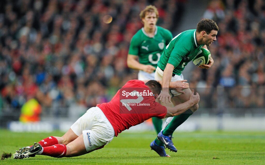 5 February 2012; Fergus McFadden, Ireland, is tackled by Huw Bennett, Wales. RBS Six Nations Rugby Championship, Ireland v Wales, Aviva Stadium, Lansdowne Road, Dublin. Picture credit: Brian Lawless / SPORTSFILE