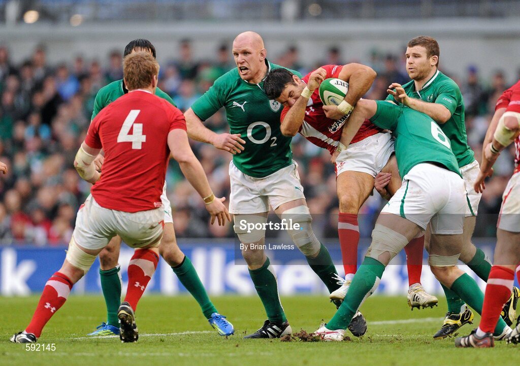 5 February 2012; Mike Phillips, Wales, is tackled by Stephen Ferris, Paul O'Connell, left, and Gordon D'Arcy, behind, Ireland. RBS Six Nations Rugby Championship, Ireland v Wales, Aviva Stadium, Lansdowne Road, Dublin. Picture credit: Brian Lawless / SPORTSFILE