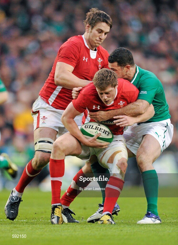 5 February 2012; Rhys Priestland, Wales, with support from team mate Ryan Jones, is tackled by Rob Kearney, Ireland. RBS Six Nations Rugby Championship, Ireland v Wales, Aviva Stadium, Lansdowne Road, Dublin. Picture credit: Brian Lawless / SPORTSFILE
