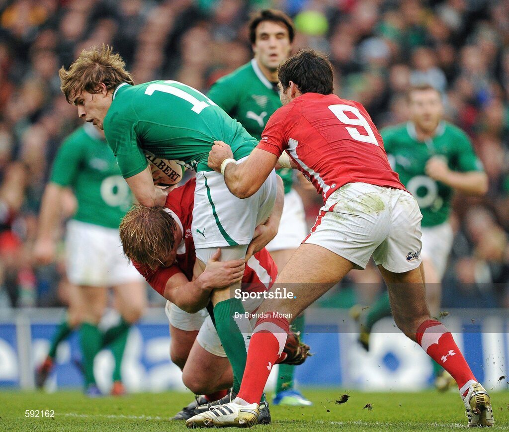 5 February 2012; Andrew Trimble, Ireland, is tackled by Rhys Gill, left, and Mike Phillips, Wales. RBS Six Nations Rugby Championship, Ireland v Wales, Aviva Stadium, Lansdowne Road, Dublin. Picture credit: Brendan Moran / SPORTSFILE