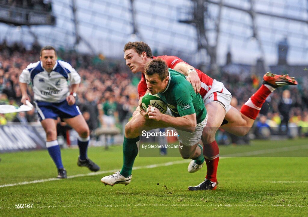 5 February 2012; Tommy Bowe, Ireland, on his way to scoring his side's second try, despite the attention of George North, Wales. RBS Six Nations Rugby Championship, Ireland v Wales, Aviva Stadium, Lansdowne Road, Dublin. Picture credit: Stephen McCarthy / SPORTSFILE