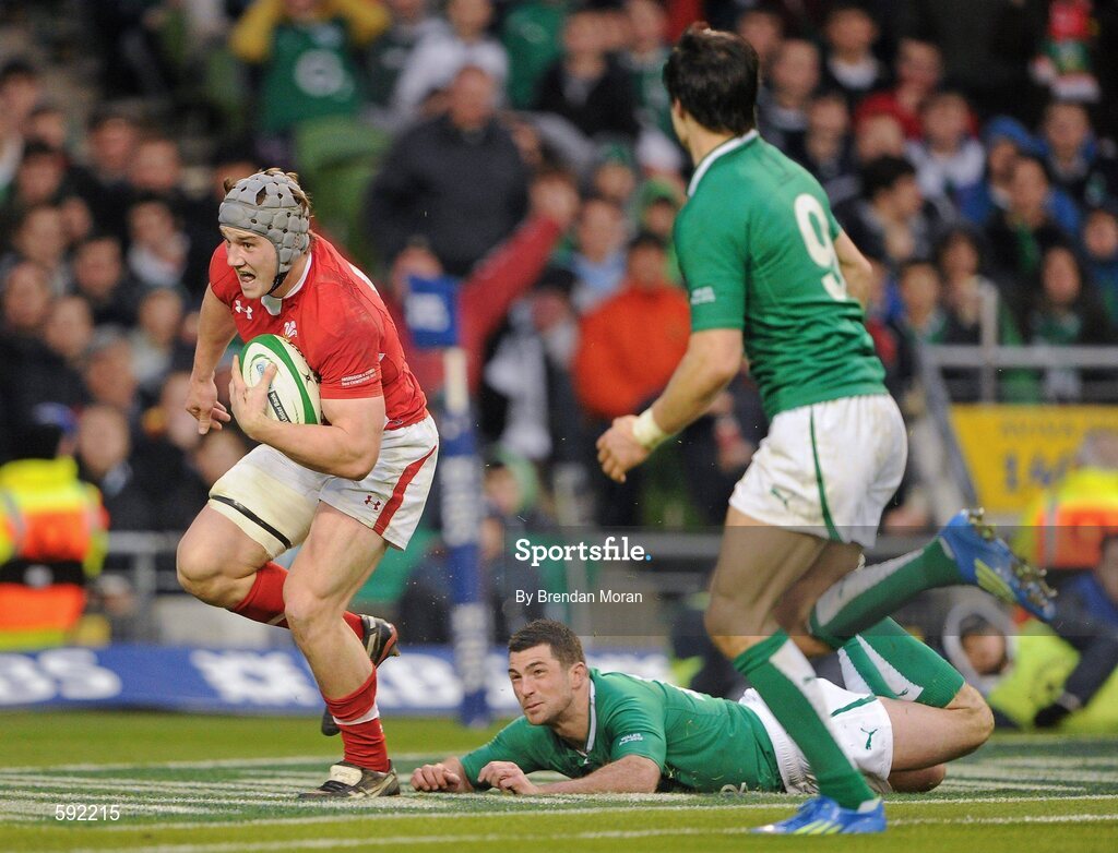 5 February 2012; Jonathan Davies, Wales, on his way to scoring a try despite the attentions of Rob Kearney and Conor Murray, 9, Ireland. RBS Six Nations Rugby Championship, Ireland v Wales, Aviva Stadium, Lansdowne Road, Dublin. Picture credit: Brendan Moran / SPORTSFILE