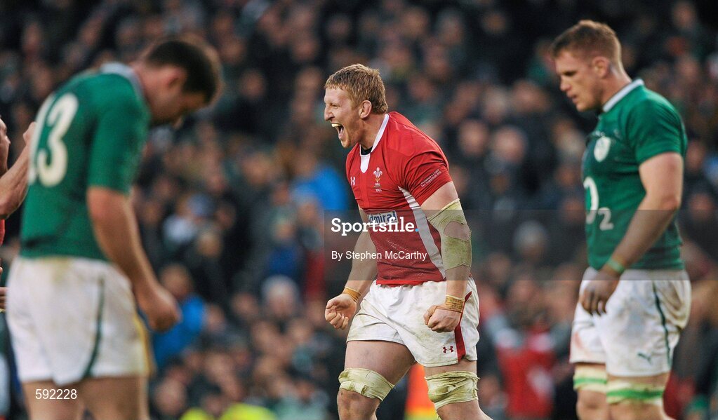 5 February 2012; Bradley Davies, Wales, celebrates his side's victory as Fergus McFadden and Jamie Heaslip, Ireland, come to terms with defeat. RBS Six Nations Rugby Championship, Ireland v Wales, Aviva Stadium, Lansdowne Road, Dublin. Picture credit: Stephen McCarthy / SPORTSFILE