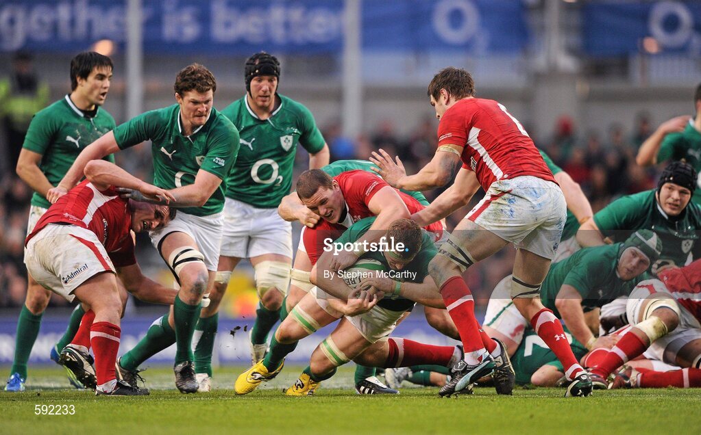 5 February 2012; Jamie Heaslip, Ireland, is tackled by Ian Evans, Wales. RBS Six Nations Rugby Championship, Ireland v Wales, Aviva Stadium, Lansdowne Road, Dublin. Picture credit: Stephen McCarthy / SPORTSFILE