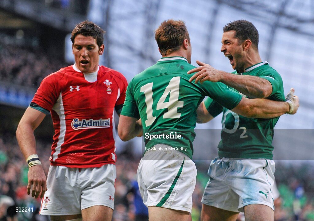 5 February 2012; Tommy Bowe, Ireland, 14, is congratulated by team-mate Rob Kearney after scoring his side's second try, as James Hook, Wales, looks away. RBS Six Nations Rugby Championship, Ireland v Wales, Aviva Stadium, Lansdowne Road, Dublin. Picture credit: Stephen McCarthy / SPORTSFILE
