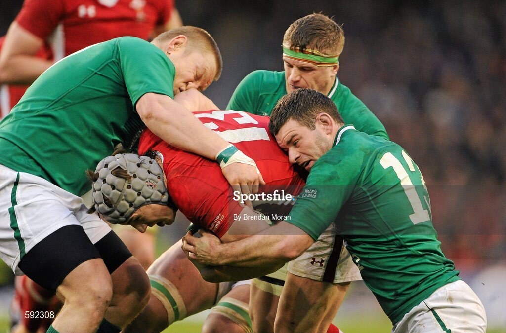 5 February 2012; Jonathan Davies, Wales, is tackled by Tom Court, left, Jamie Heaslip and Fergus McFadden, Ireland. RBS Six Nations Rugby Championship, Ireland v Wales, Aviva Stadium, Lansdowne Road, Dublin. Picture credit: Brendan Moran / SPORTSFILE