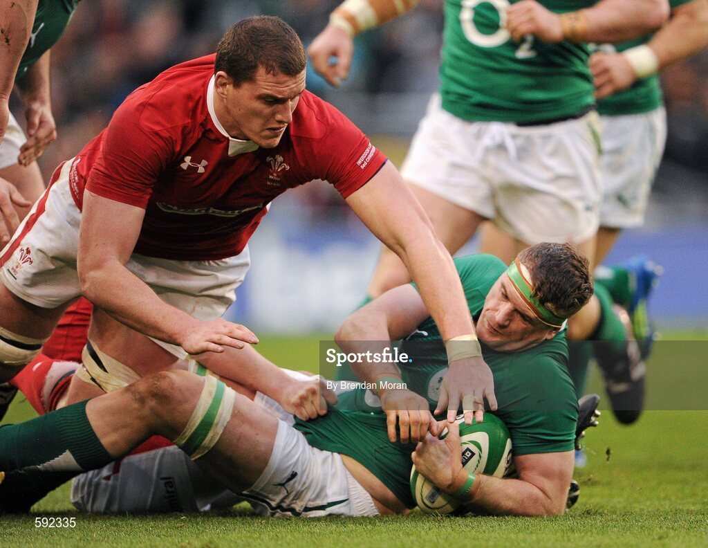 5 February 2012; Sam Warburton, Wales, attempts to steal the ball from Jamie Heaslip, Ireland. RBS Six Nations Rugby Championship, Ireland v Wales, Aviva Stadium, Lansdowne Road, Dublin. Picture credit: Brendan Moran / SPORTSFILE