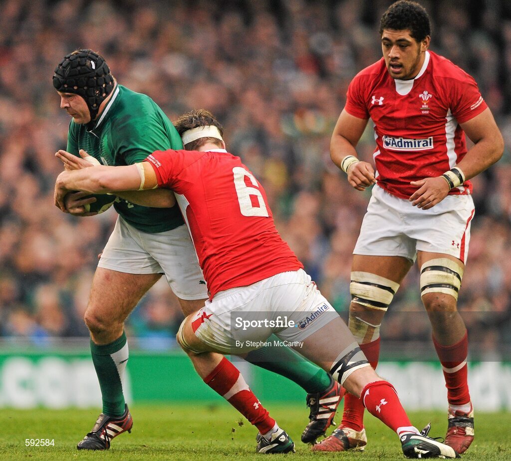 5 February 2012; Mike Ross, Ireland, is tackled by Toby Faletau, Wales. RBS Six Nations Rugby Championship, Ireland v Wales, Aviva Stadium, Lansdowne Road, Dublin. Picture credit: Stephen McCarthy / SPORTSFILE
