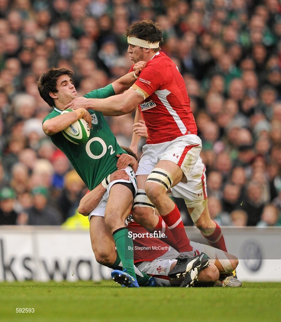 5 February 2012; Conor Murray, Ireland, is tackled by Jamie Roberts and Ryan Jones, right, Wales. RBS Six Nations Rugby Championship, Ireland v Wales, Aviva Stadium, Lansdowne Road, Dublin. Picture credit: Stephen McCarthy / SPORTSFILE