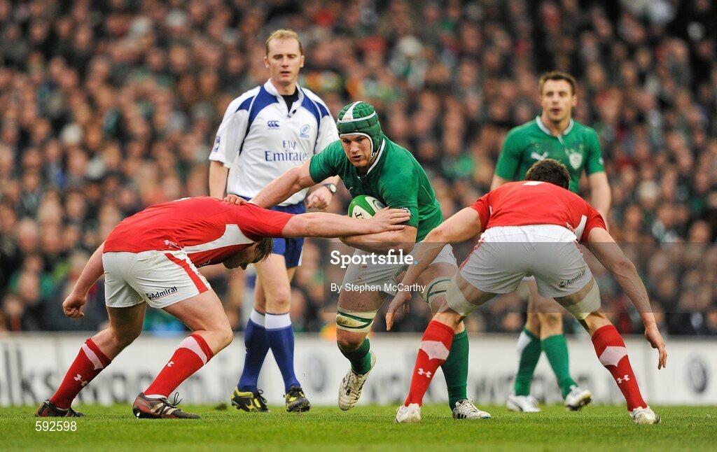 5 February 2012; Sean O'Brien, Ireland, in action against Rhys Gill, left, and Sam Warburton, Wales. RBS Six Nations Rugby Championship, Ireland v Wales, Aviva Stadium, Lansdowne Road, Dublin. Picture credit: Stephen McCarthy / SPORTSFILE