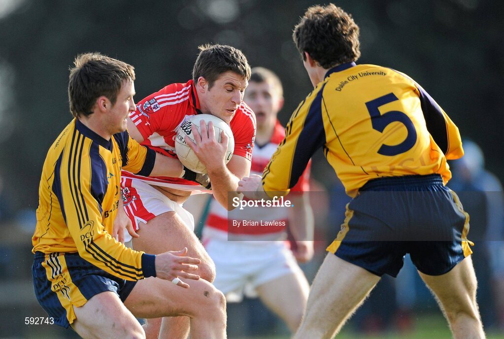 7 February 2012; Hugh Curran, Cork Institute of Technology, in action against Eoin Culligan, left, and Neil Collins, Dublin City University. Irish Daily Mail Sigerson Cup, Round 1, Dublin City University v Cork Institute of Technology, DCU Sportsgrounds, Ballymun, Dublin. Picture credit: Brian Lawless / SPORTSFILE