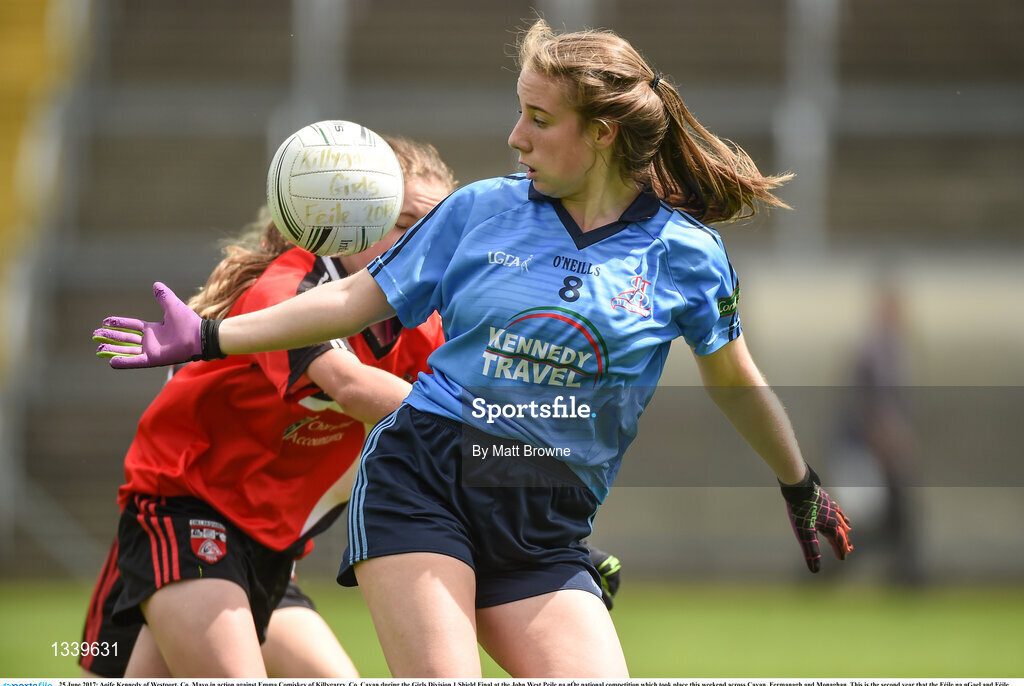 25 June 2017; Aoife Kennedy of Westport, Co. Mayo in action against Emma Comiskey of Killygarry, Co. Cavan during the Girls Division 1 Shield Final at the John West Peile na nÓg national competition which took place this weekend across Cavan, Fermanagh and Monaghan. This is the second year that the Féile na nGael and Féile Peile na nÓg have been sponsored by John West, one of the world’s leading suppliers of fish. The competition gives up-and-coming GAA superstars the chance to participate and play in their respective Féile tournament, at a level which suits their age, skills and strengths.   Photo by Matt Browne/Sportsfile