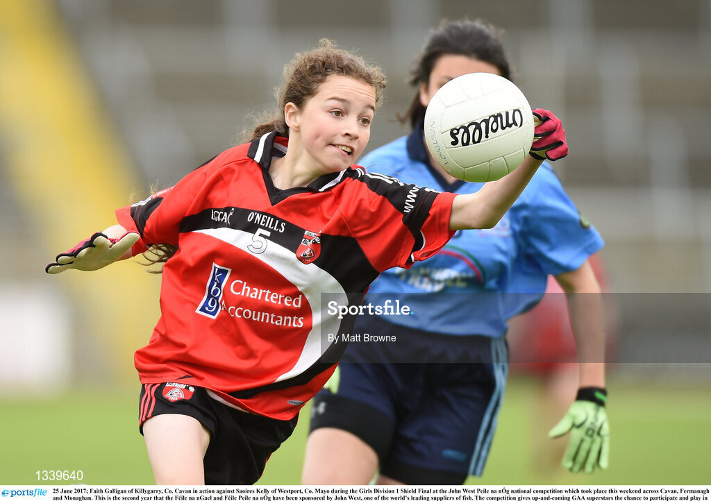 25 June 2017; Faith Galligan of Killygarry, Co. Cavan in action against Saoires Kelly of Westport, Co. Mayo during the Girls Division 1 Shield Final at the John West Peile na nÓg national competition which took place this weekend across Cavan, Fermanagh and Monaghan. This is the second year that the Féile na nGael and Féile Peile na nÓg have been sponsored by John West, one of the world’s leading suppliers of fish. The competition gives up-and-coming GAA superstars the chance to participate and play in their respective Féile tournament, at a level which suits their age, skills and strengths.   Photo by Matt Browne/Sportsfile