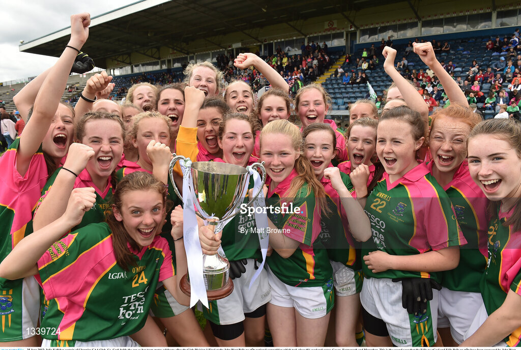 25 June 2017; Julia Kelleher captain of Glanmire GAA Club, Co. Cork holds the cup as her team-mates celebrate after the Girls Division 1 Final at the John West Peile na nÓg national competition which took place this weekend across Cavan, Fermanagh and Monaghan. This is the second year that the Féile na nGael and Féile Peile na nÓg have been sponsored by John West, one of the world’s leading suppliers of fish. The competition gives up-and-coming GAA superstars the chance to participate and play in their respective Féile tournament, at a level which suits their age, skills and strengths.   Photo by Matt Browne/Sportsfile