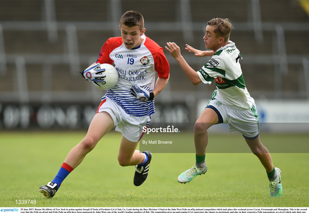 25 June 2017; Ronan McAllister of New York in action against Joseph O'Toole of Portlaois GAA Club, Co. Laois during the Boys Division 1 Final at the John West Peile na nÓg national competition which took place this weekend across Cavan, Fermanagh and Monaghan. This is the second year that the Féile na nGael and Féile Peile na nÓg have been sponsored by John West, one of the world’s leading suppliers of fish. The competition gives up-and-coming GAA superstars the chance to participate and play in their respective Féile tournament, at a level which suits their age, skills and strengths.   Photo by Matt Browne/Sportsfile