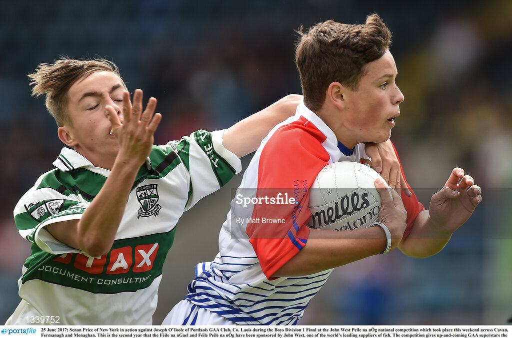 25 June 2017; Senan Price of New York in action against Joseph O'Toole of Portlaois GAA Club, Co. Laois during the Boys Division 1 Final at the John West Peile na nÓg national competition which took place this weekend across Cavan, Fermanagh and Monaghan. This is the second year that the Féile na nGael and Féile Peile na nÓg have been sponsored by John West, one of the world’s leading suppliers of fish. The competition gives up-and-coming GAA superstars the chance to participate and play in their respective Féile tournament, at a level which suits their age, skills and strengths.   Photo by Matt Browne/Sportsfile