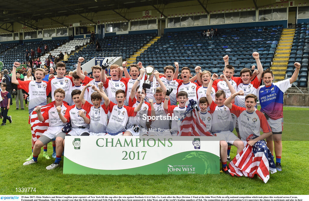 25 June 2017; Oisin Mathers and Brian Coughlan joint captain's of New York lift the cup after the win against Portlaois GAA Club, Co. Laois after the Boys Division 1 Final at the John West Peile na nÓg national competition which took place this weekend across Cavan, Fermanagh and Monaghan. This is the second year that the Féile na nGael and Féile Peile na nÓg have been sponsored by John West, one of the world’s leading suppliers of fish. The competition gives up-and-coming GAA superstars the chance to participate and play in their respective Féile tournament, at a level which suits their age, skills and strengths.   Photo by Matt Browne/Sportsfile