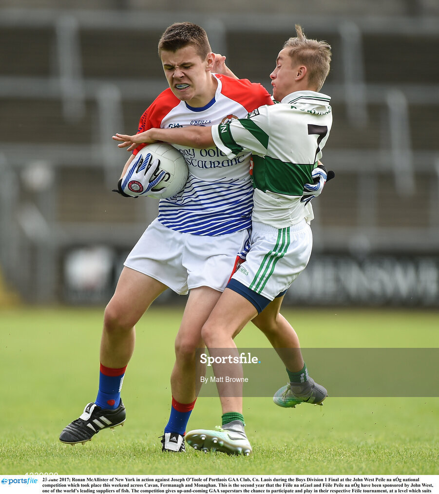 25 June 2017; Ronan McAllister of New York in action against Joseph O'Toole of Portlaois GAA Club, Co. Laois during the Boys Division 1 Final at the John West Peile na nÓg national competition which took place this weekend across Cavan, Fermanagh and Monaghan. This is the second year that the Féile na nGael and Féile Peile na nÓg have been sponsored by John West, one of the world’s leading suppliers of fish. The competition gives up-and-coming GAA superstars the chance to participate and play in their respective Féile tournament, at a level which suits their age, skills and strengths.   Photo by Matt Browne/Sportsfile