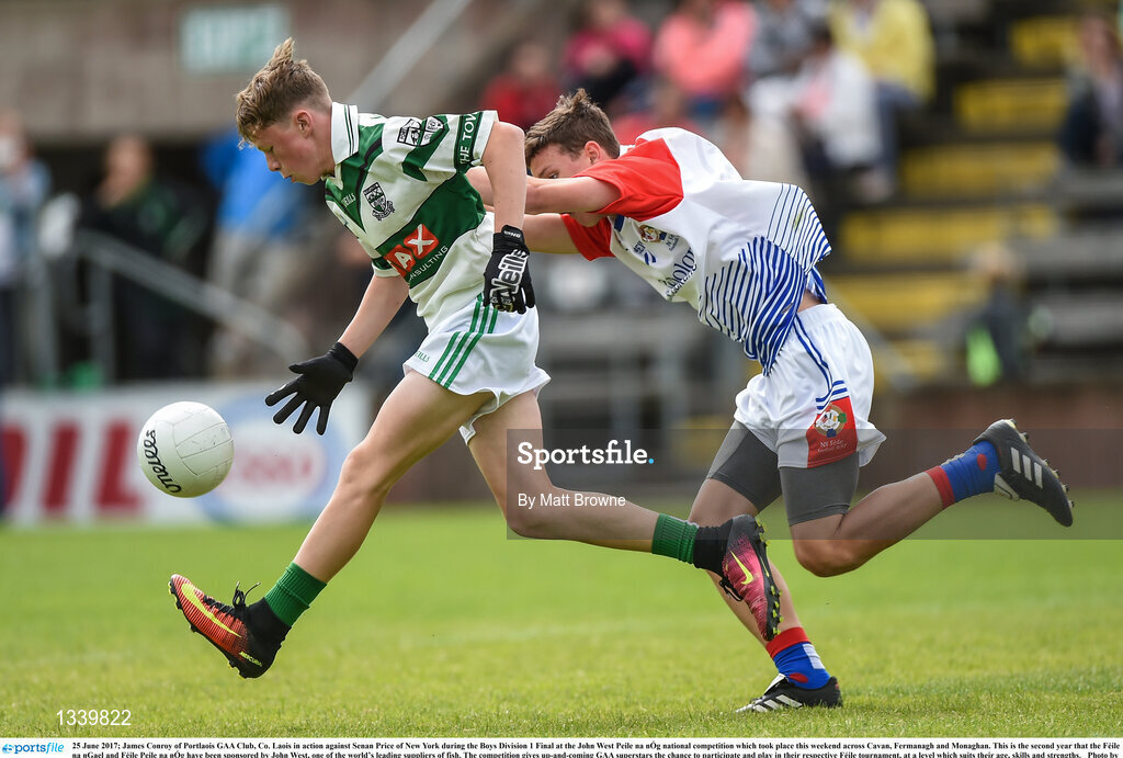 25 June 2017; James Conroy of Portlaois GAA Club, Co. Laois in action against Senan Price of New York during the Boys Division 1 Final at the John West Peile na nÓg national competition which took place this weekend across Cavan, Fermanagh and Monaghan. This is the second year that the Féile na nGael and Féile Peile na nÓg have been sponsored by John West, one of the world’s leading suppliers of fish. The competition gives up-and-coming GAA superstars the chance to participate and play in their respective Féile tournament, at a level which suits their age, skills and strengths.   Photo by Matt Browne/Sportsfile