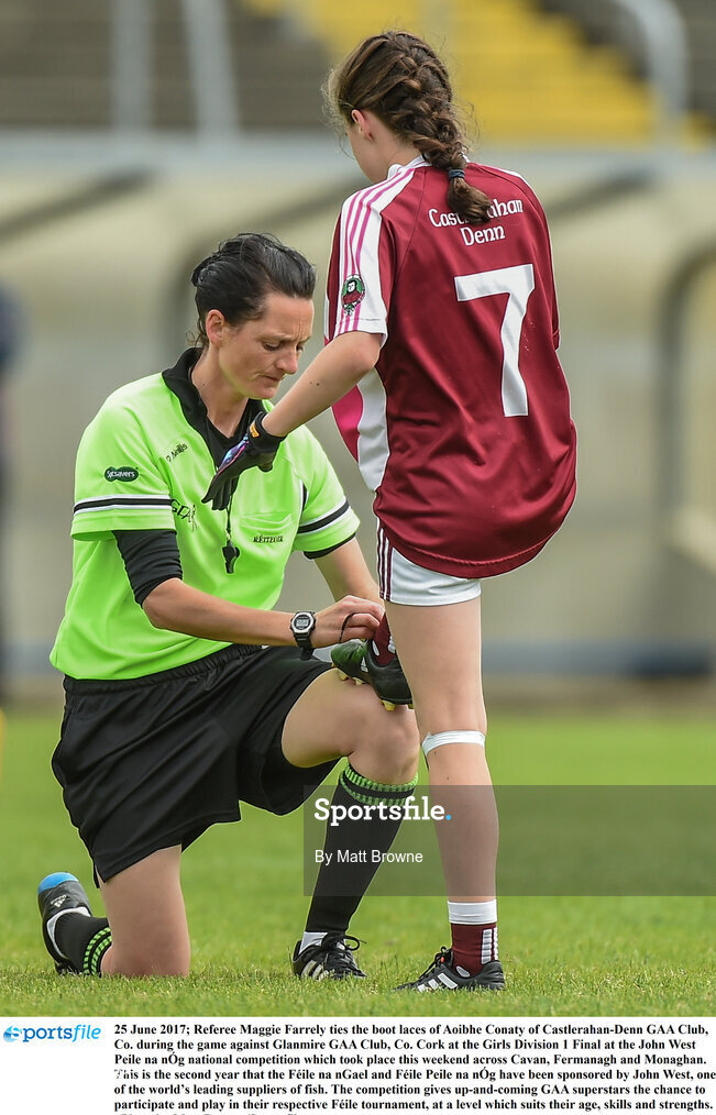 25 June 2017; Referee Maggie Farrely ties the boot laces of Aoibhe Conaty of Castlerahan-Denn GAA Club, Co. during the game against Glanmire GAA Club, Co. Cork at the Girls Division 1 Final at the John West Peile na nÓg national competition which took place this weekend across Cavan, Fermanagh and Monaghan. This is the second year that the Féile na nGael and Féile Peile na nÓg have been sponsored by John West, one of the world’s leading suppliers of fish. The competition gives up-and-coming GAA superstars the chance to participate and play in their respective Féile tournament, at a level which suits their age, skills and strengths.   Photo by Matt Browne/Sportsfile