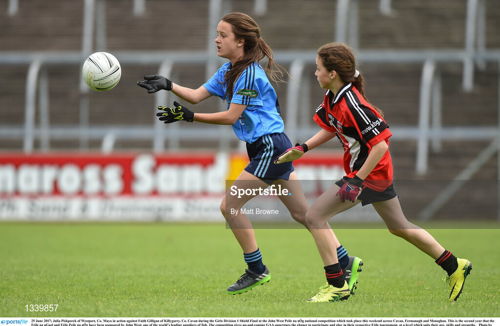 25 June 2017; Julia Piskporek of Westport, Co. Mayo in action against Faith Gilligan of Killygarry, Co. Cavan during the Girls Division 1 Shield Final at the John West Peile na nÓg national competition which took place this weekend across Cavan, Fermanagh and Monaghan. This is the second year that the Féile na nGael and Féile Peile na nÓg have been sponsored by John West, one of the world’s leading suppliers of fish. The competition gives up-and-coming GAA superstars the chance to participate and play in their respective Féile tournament, at a level which suits their age, skills and strengths.   Photo by Matt Browne/Sportsfile