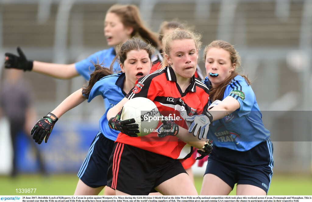 25 June 2017; Deirdhile Lynch of Killygarry, Co. Cavan in action against Westport, Co. Mayo during the Girls Division 1 Shield Final at the John West Peile na nÓg national competition which took place this weekend across Cavan, Fermanagh and Monaghan. This is the second year that the Féile na nGael and Féile Peile na nÓg have been sponsored by John West, one of the world’s leading suppliers of fish. The competition gives up-and-coming GAA superstars the chance to participate and play in their respective Féile tournament, at a level which suits their age, skills and strengths.   Photo by Matt Browne/Sportsfile