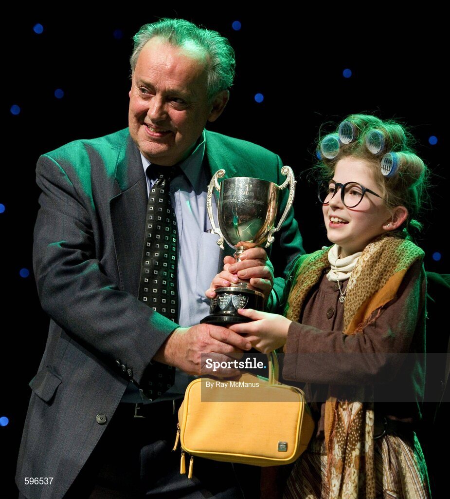 18 February 2012; Roisín Ní Bhrádaig, St Patrick's GAA Club, Palmerstown, Dublin, who won the All-Ireland Title for 'Recitation / Storytelling' in the All-Ireland Scór na nÓg Final 2012, is presented with the cup by Paddy Naughton, Cathaoirleach, Comhairle Connacht. Royal Theatre & Events Centre, Castlebar, Co. Mayo. Picture credit: Ray McManus / SPORTSFILE